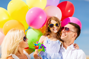 Image showing family with colorful balloons