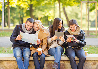 Image showing couples with tourist map in autumn park