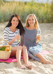 Image showing girls with drinks on the beach