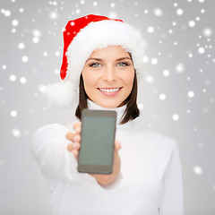 Image showing woman in santa helper hat with smartphone