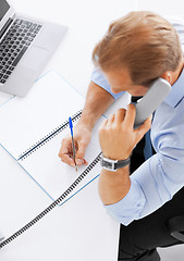 Image showing handsome businessman talking on the phone