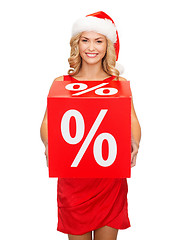 Image showing woman in santa helper hat with red sale sign