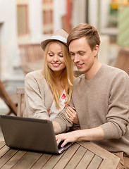 Image showing couple with laptop in cafe