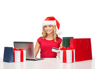 Image showing woman with gifts, laptop computer and credit card