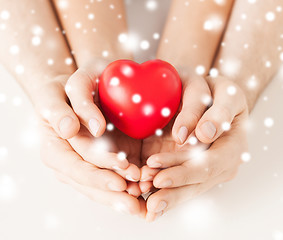 Image showing woman and man hands with heart