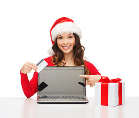 Image showing woman with gift, laptop computer and credit card