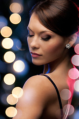 Image showing woman in evening dress wearing diamond earrings