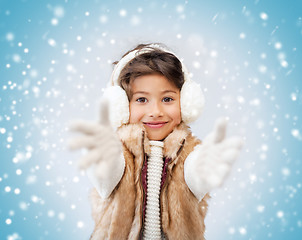 Image showing happy littl girl in winter clothes