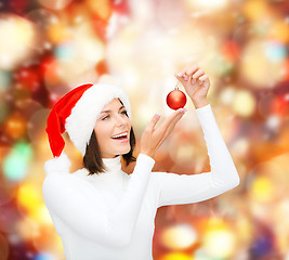Image showing woman in santa helper hat with christmas ball