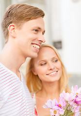 Image showing couple with flowers in the city