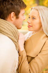 Image showing romantic couple kissing in the autumn park