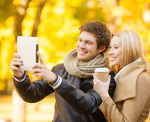 Image showing couple taking photo picture autumn park