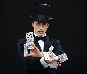 Image showing magician showing trick with playing cards