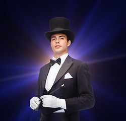 Image showing magician in top hat with magic wand showing trick