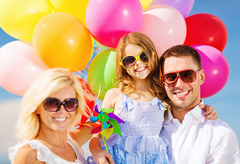 Image showing family with colorful balloons