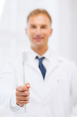 Image showing dentist with toothbrush in hospital
