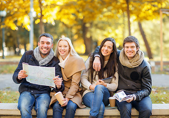 Image showing couples with tourist map in autumn park