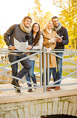 Image showing couples with tourist map in autumn park