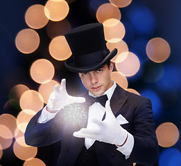 Image showing magician in top hat showing trick