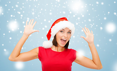 Image showing surprised woman in santa helper hat