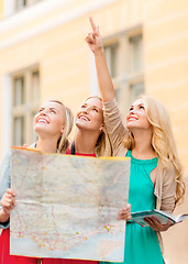 Image showing beautiful women with tourist map in the city