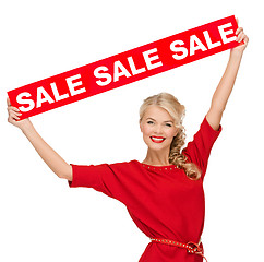 Image showing woman in dress with red sale sign