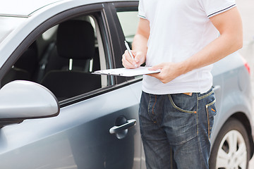 Image showing man with car documents