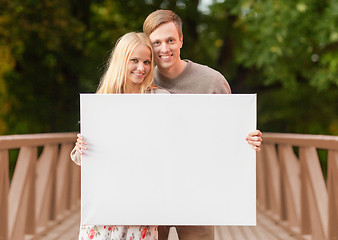 Image showing romantic couple with blank white board