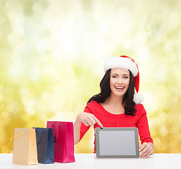 Image showing woman in santa helper hat with tablet pc