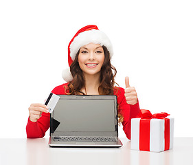 Image showing woman with gift, laptop computer and credit card