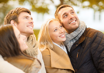 Image showing group of friends having fun in autumn park