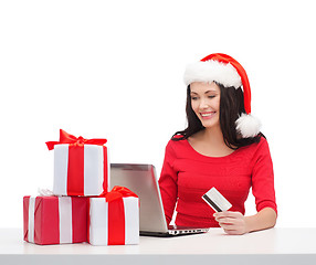 Image showing woman with gifts, laptop computer and credit card