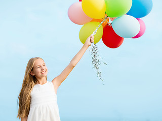 Image showing happy girl with colorful balloons