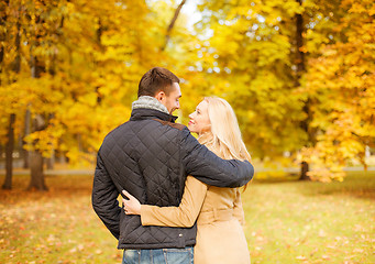 Image showing romantic couple kissing in the autumn park