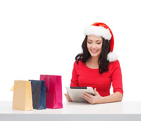 Image showing woman with gift box and tablet pc computer