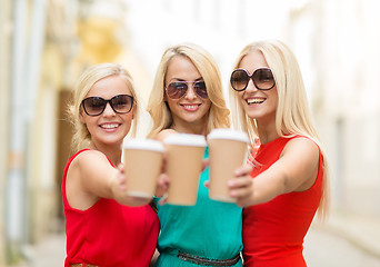 Image showing women with takeaway coffee cups in the city