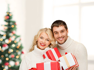 Image showing smiling woman and man with gift box