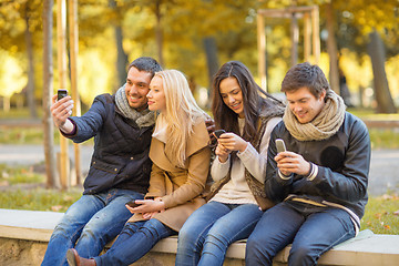 Image showing group of friends having fun in autumn park