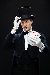 Image showing magician showing trick with playing cards