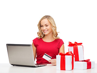 Image showing woman with gifts, laptop computer and credit card