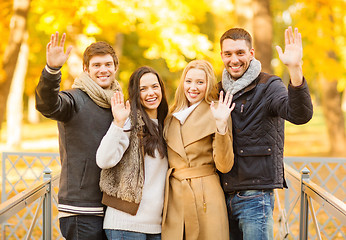 Image showing group of friends having fun in autumn park