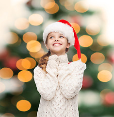 Image showing dreaming girl in santa helper hat