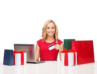 Image showing woman with gifts, laptop computer and credit card