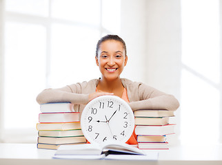 Image showing attractive woman with white clock