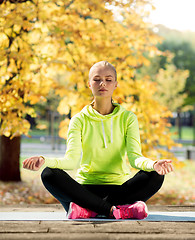 Image showing woman doing yoga outdoors