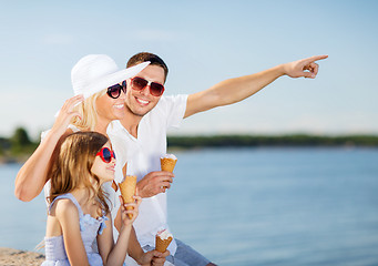 Image showing happy family eating ice cream