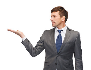 Image showing buisnessman or teacher showing something