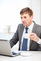Image showing businessman working with laptop computer