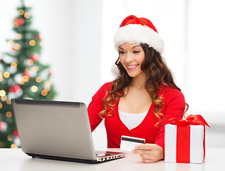 Image showing woman with gift, laptop computer and credit card