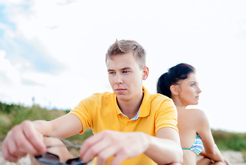 Image showing stressed couple outside